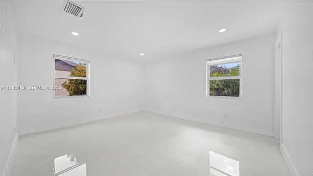 an empty room with windows