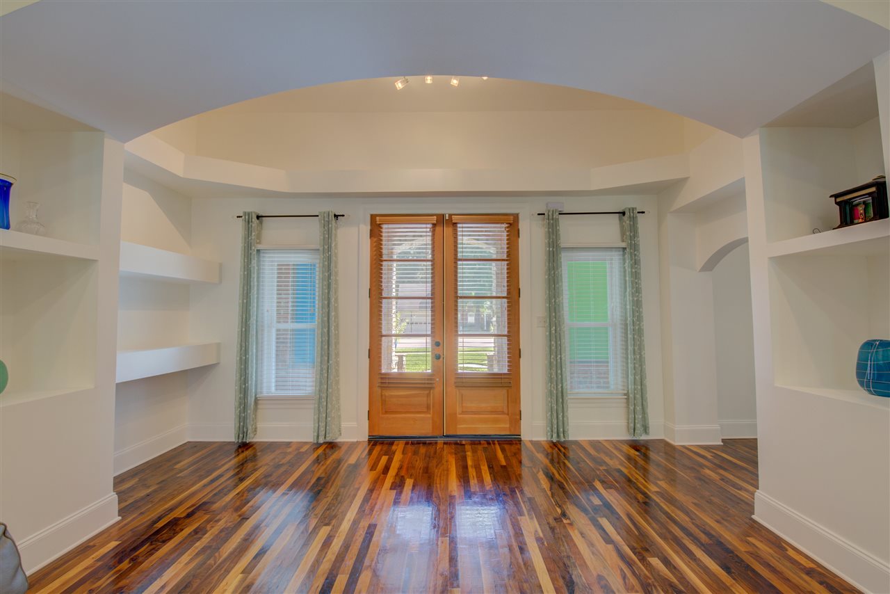 Guests will be impressed the moment they enter the gracious entry with built-in shelving.