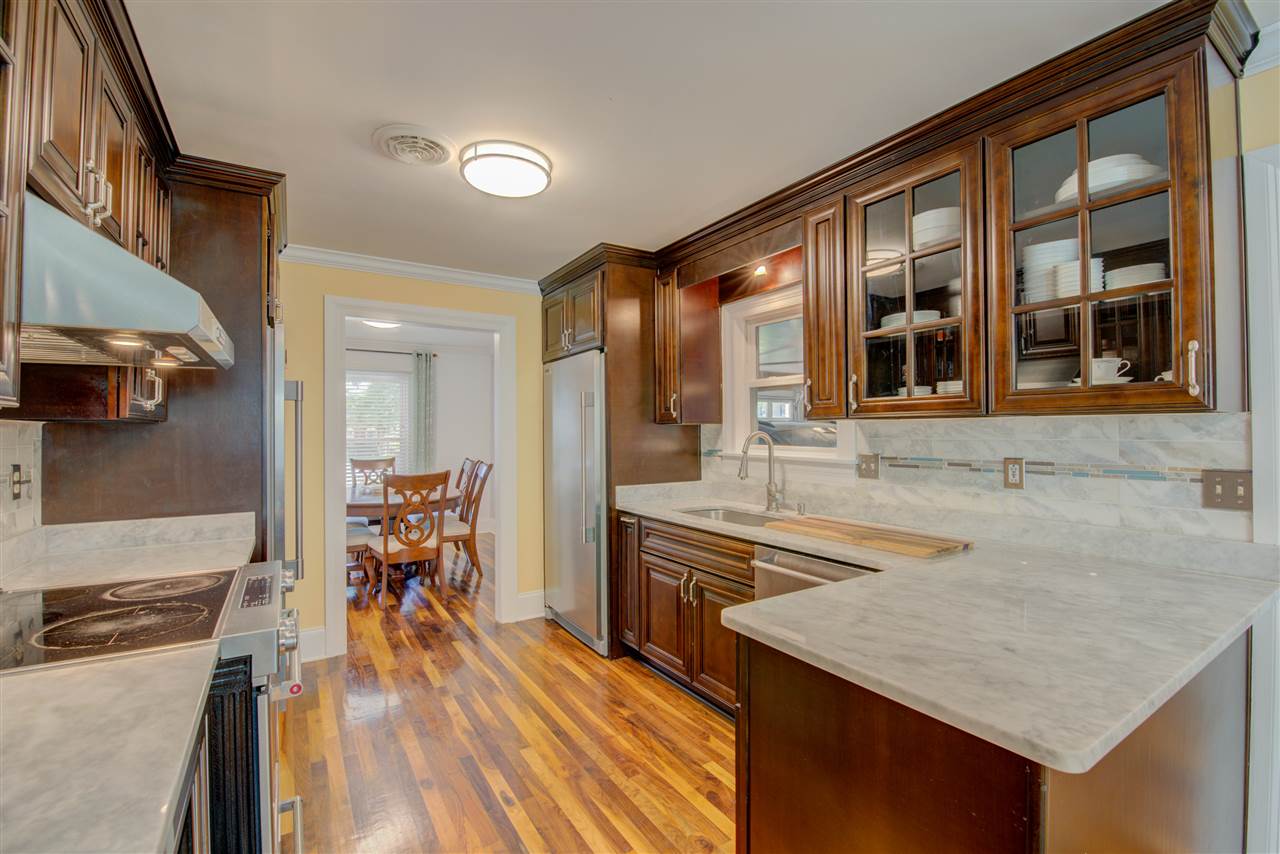 1915 Corbin Road Germantown, TN 38139 - Photo 11 of 25 Notice the desirable marble countertops, stainless steel appliances, and beautiful cabinetry.