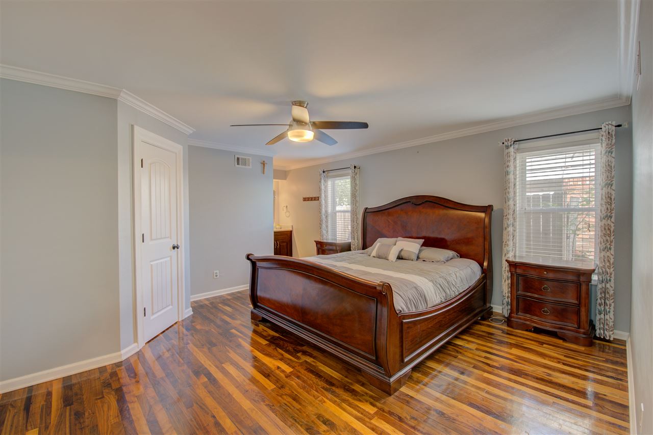 1915 Corbin Road Germantown, TN 38139 - Photo 13 of 25 You will rest easy in your romantic master retreat with a walk-in closet, crown molding, smooth ceiling, an updated cooling ceiling fan/light and a private remodeled bathroom.