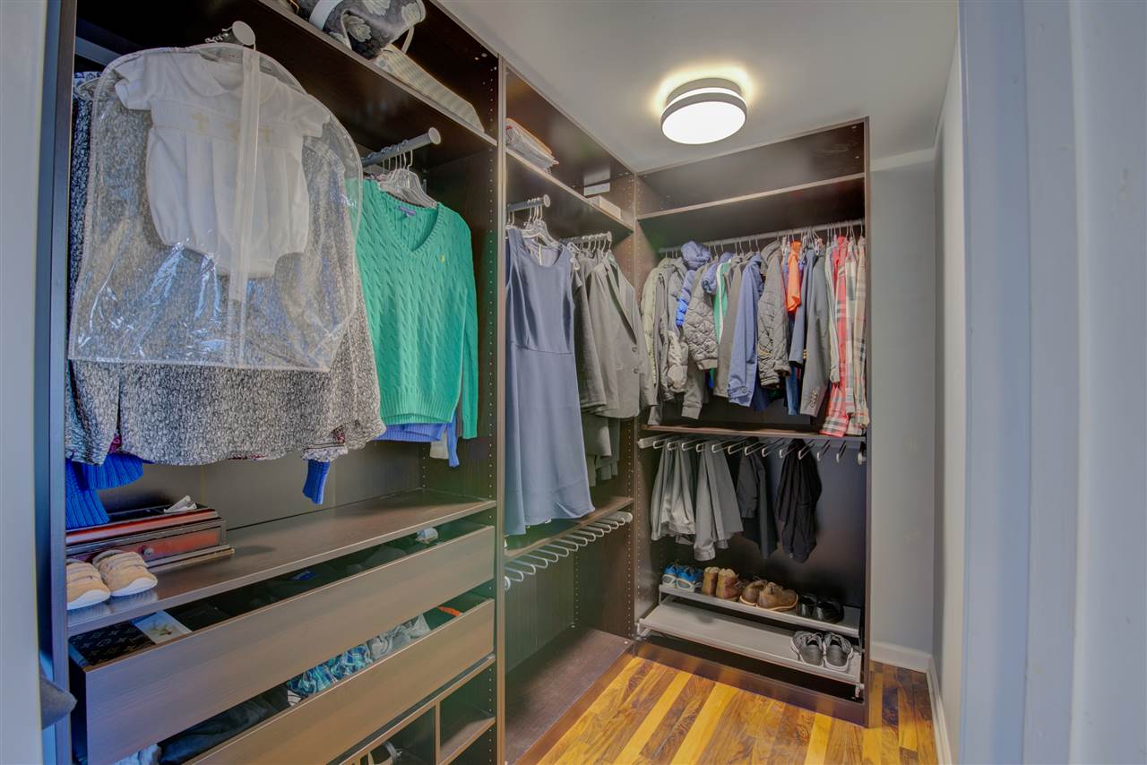 1915 Corbin Road Germantown, TN 38139 - Photo 14 of 25 Notice the incredible shelving, pull outs and drawers in the large walk-in master bedroom closet.