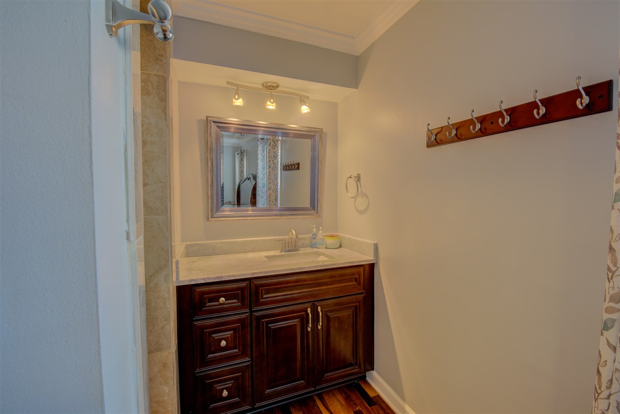 1915 Corbin Road Germantown, TN 38139 - Photo 16 of 25 Notice the beautiful marble vanity and European style track light fixture.