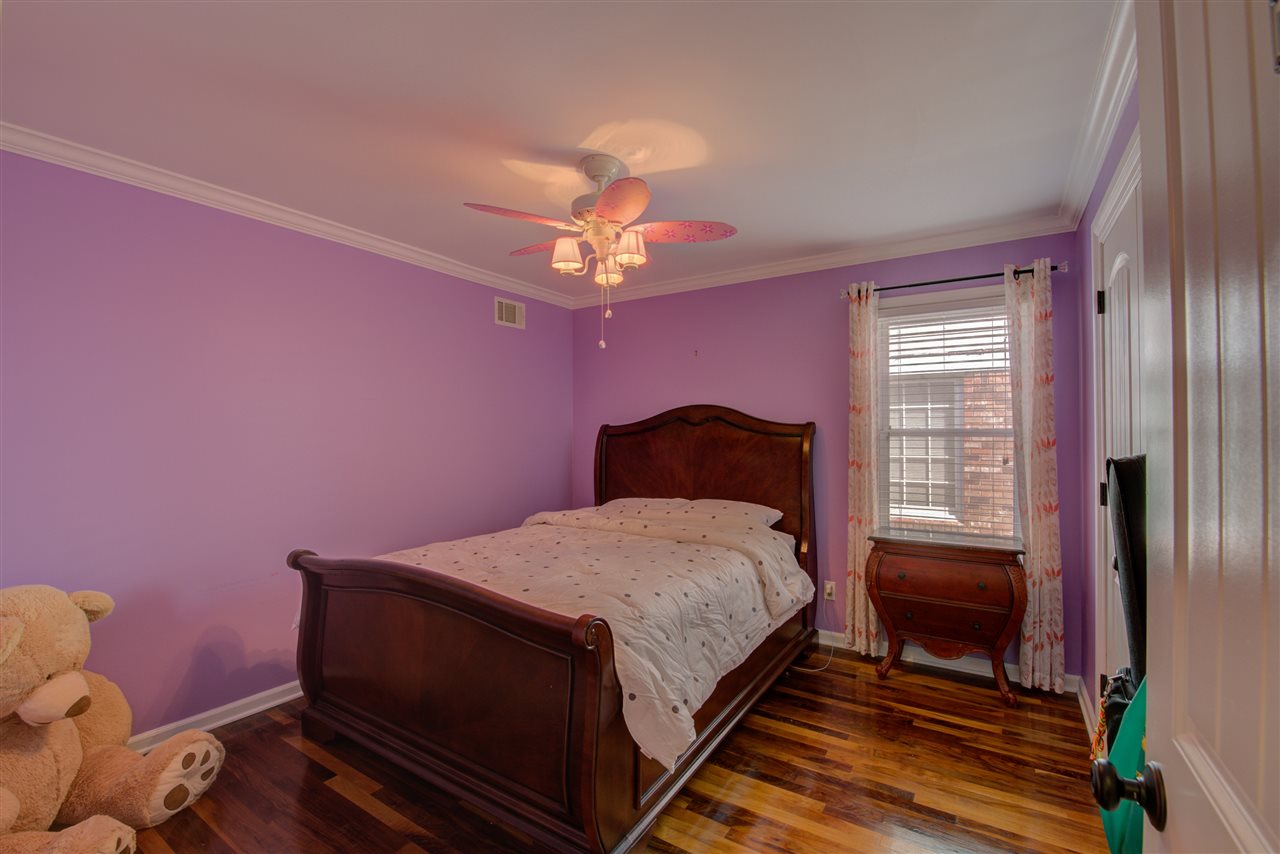 1915 Corbin Road Germantown, TN 38139 - Photo 17 of 25 Have sweet dreams in the fabulous second bedroom complete with smooth ceilings, walnut hardwood flooring, closet, cooling ceiling fans/lights, and a shared full hall bathroom.