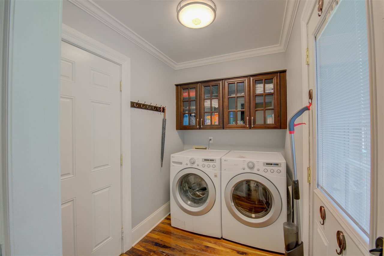 1915 Corbin Road Germantown, TN 38139 - Photo 20 of 25 Doing laundry will be a breeze in this awesome laundry room with cabinets.