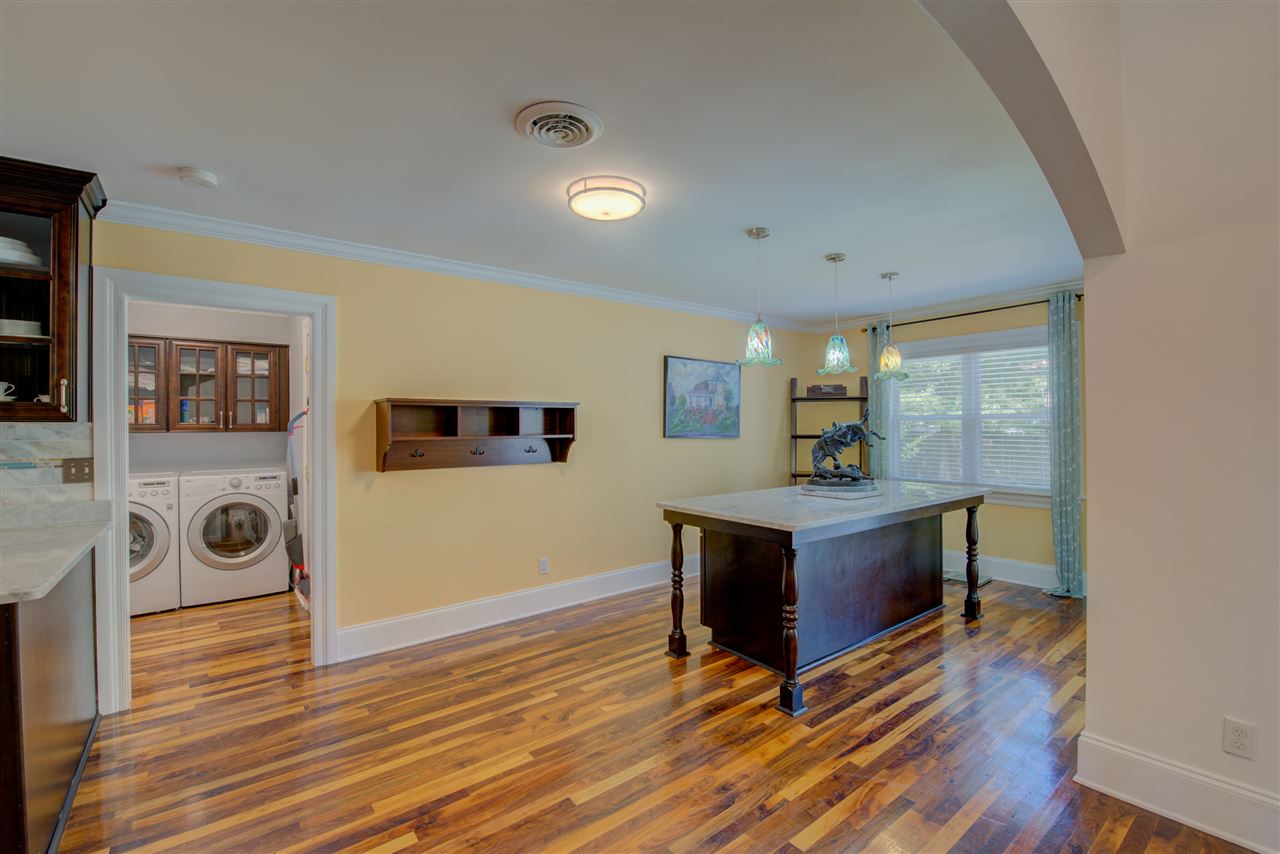 In addition, this kitchen offers a sunny breakfast area with designer pendant lighting and sliding glass doors.