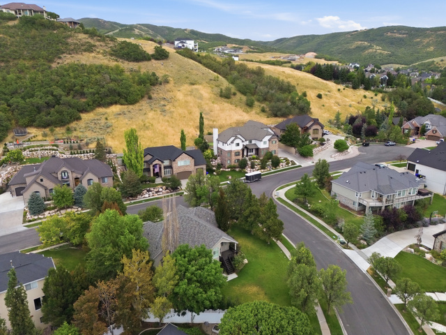 4668 Bountiful Ridge Drive Bountiful, UT 84010 - Photo 37 of 37 Residential neighborhood with landscaped properties, paved roadways, mature trees, and mountainous terrain
