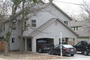 4803 Duval Street, Unit B Austin, TX 78751 - Photo 1 of 6 a car parked in front of white house