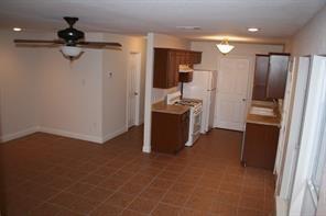 4803 Duval Street, Unit B Austin, TX 78751 - Photo 4 of 6 a kitchen with stainless steel appliances a refrigerator and a stove