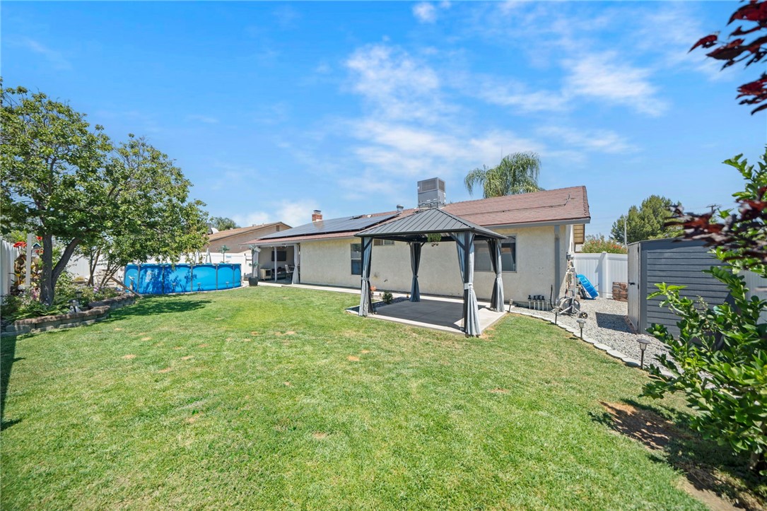 27879 Foxfire Street Menifee, CA 92586 - Photo 35 of 36 a view of a house with a yard porch and sitting area