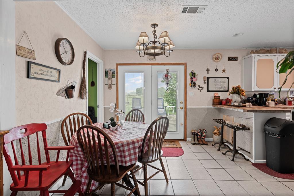 245 County Road 3696 Springtown, TX 76082 - Photo 11 of 29 a view of a dining room with furniture window and outside view