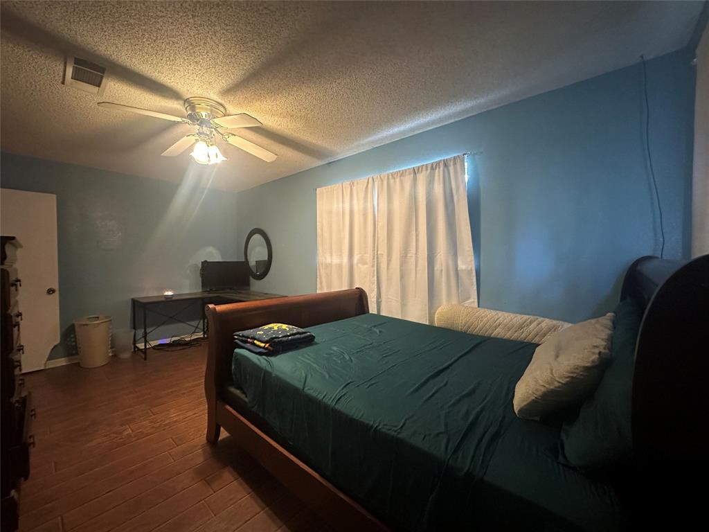 245 County Road 3696 Springtown, TX 76082 - Photo 19 of 29 a bedroom with a bed and window