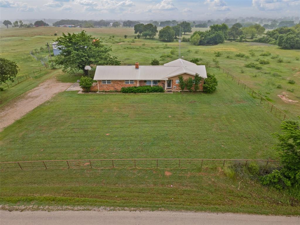 245 County Road 3696 Springtown, TX 76082 - Photo 24 of 29 a view of a field with an ocean view
