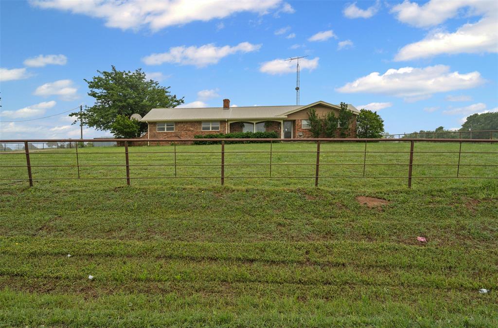 245 County Road 3696 Springtown, TX 76082 - Photo 3 of 29 a view of a green field
