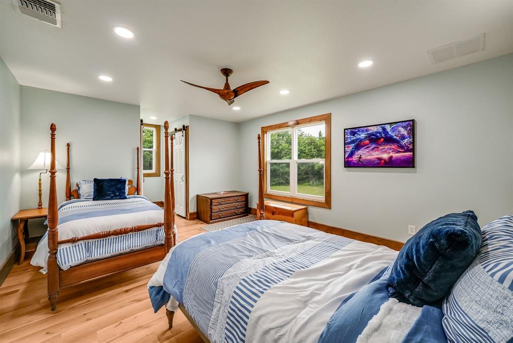 1037 Harrison Road Denison, TX 75021 - Photo 25 of 39 Bedroom #3 on second floor w/ connecting ensuite full bathroom featuring wood-finish flooring, recessed lighting, and a ceiling fan