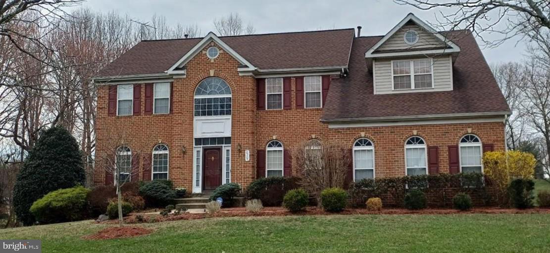 Charming brick home with elegant arches.