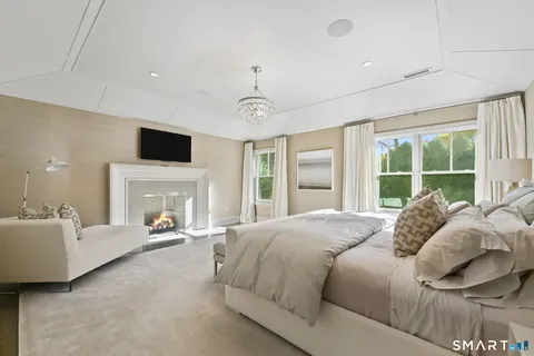 a bed room with a bed and a fireplace