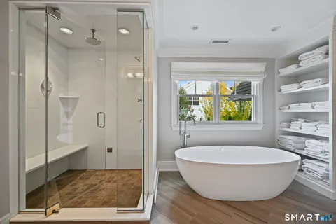 a bathroom with a tub and shower