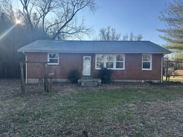 a house view with a backyard space