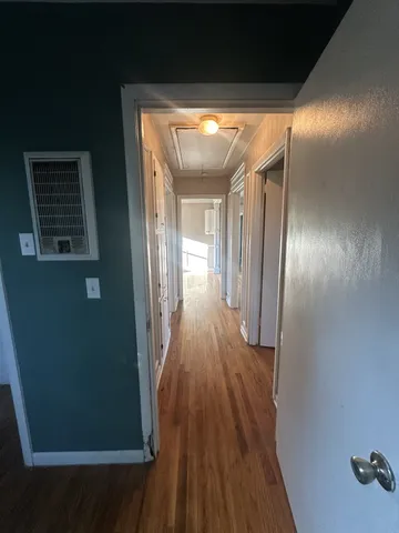 a view of gallery with wooden floor