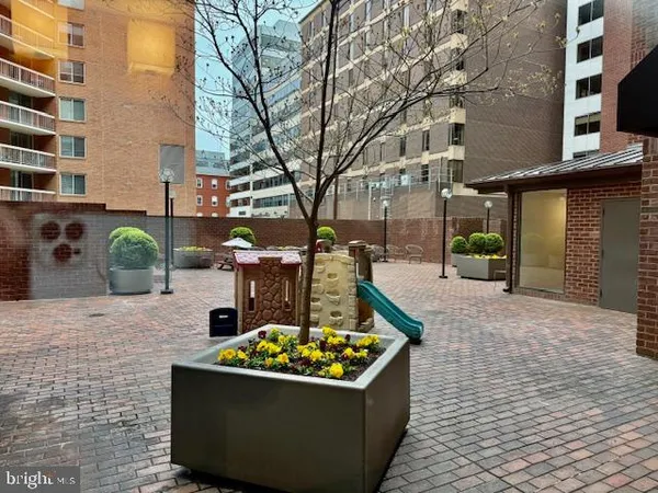 a view of a garden with an outdoor seating