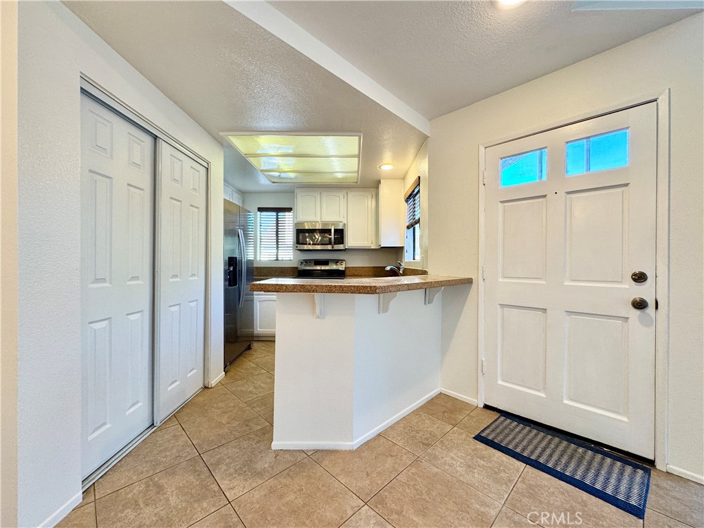 109 Fallingstar, Unit 61 Irvine, CA 92614 - Photo 13 of 34 a view of a kitchen