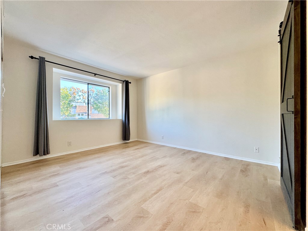 109 Fallingstar, Unit 61 Irvine, CA 92614 - Photo 19 of 34 a view of an empty room with a window