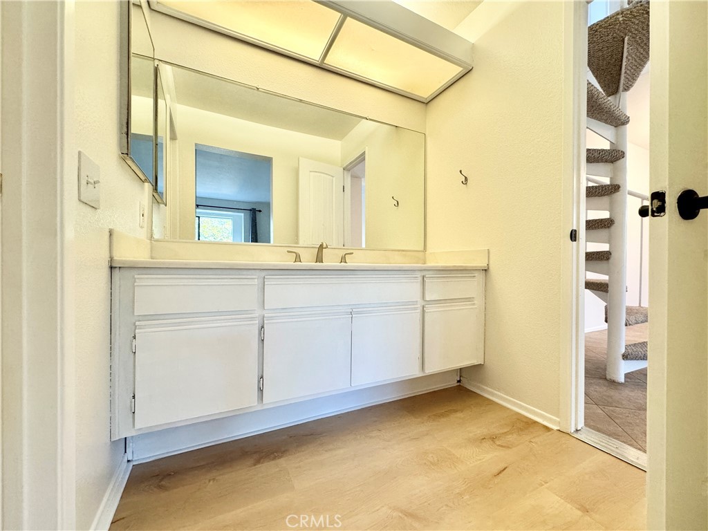 109 Fallingstar, Unit 61 Irvine, CA 92614 - Photo 26 of 34 a bathroom with a sink and a mirror