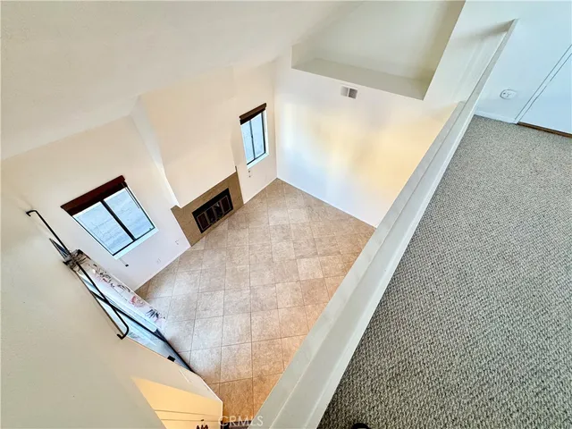 a view of a park with trees in the background