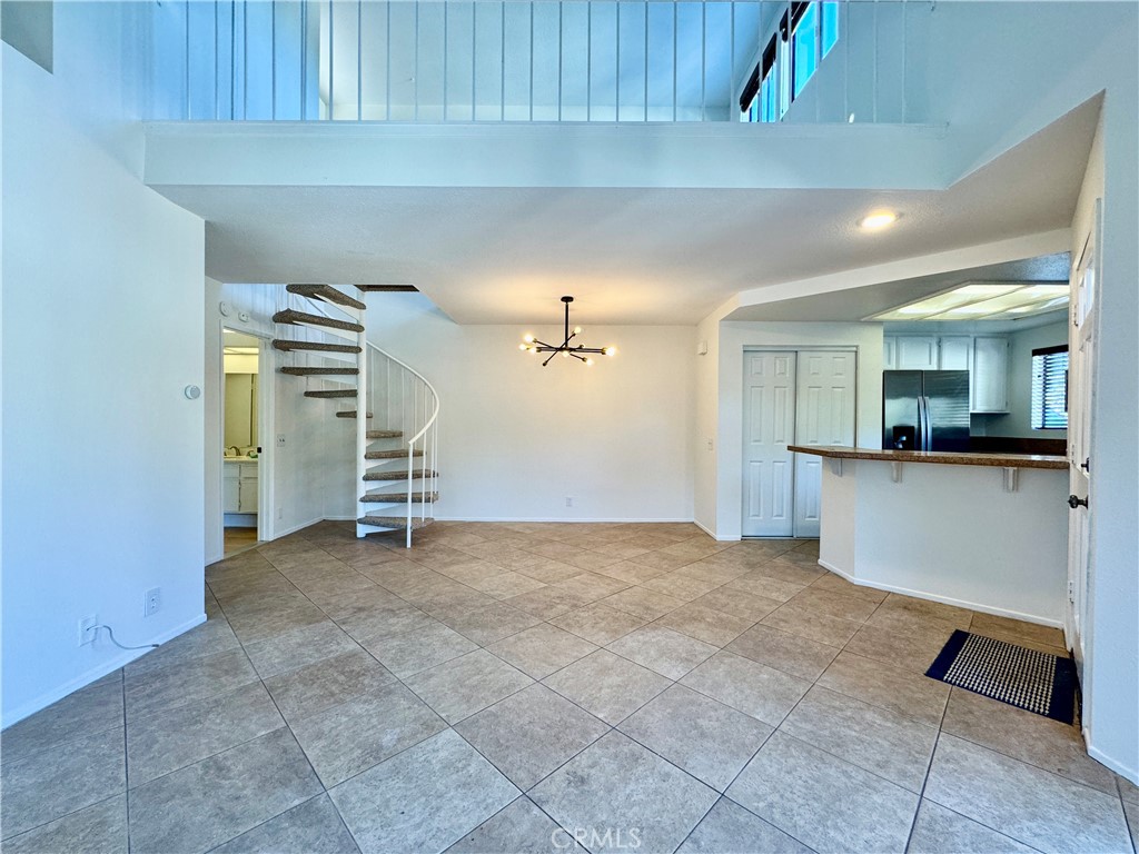 109 Fallingstar, Unit 61 Irvine, CA 92614 - Photo 10 of 34 a view of a kitchen with a sink and a refrigerator