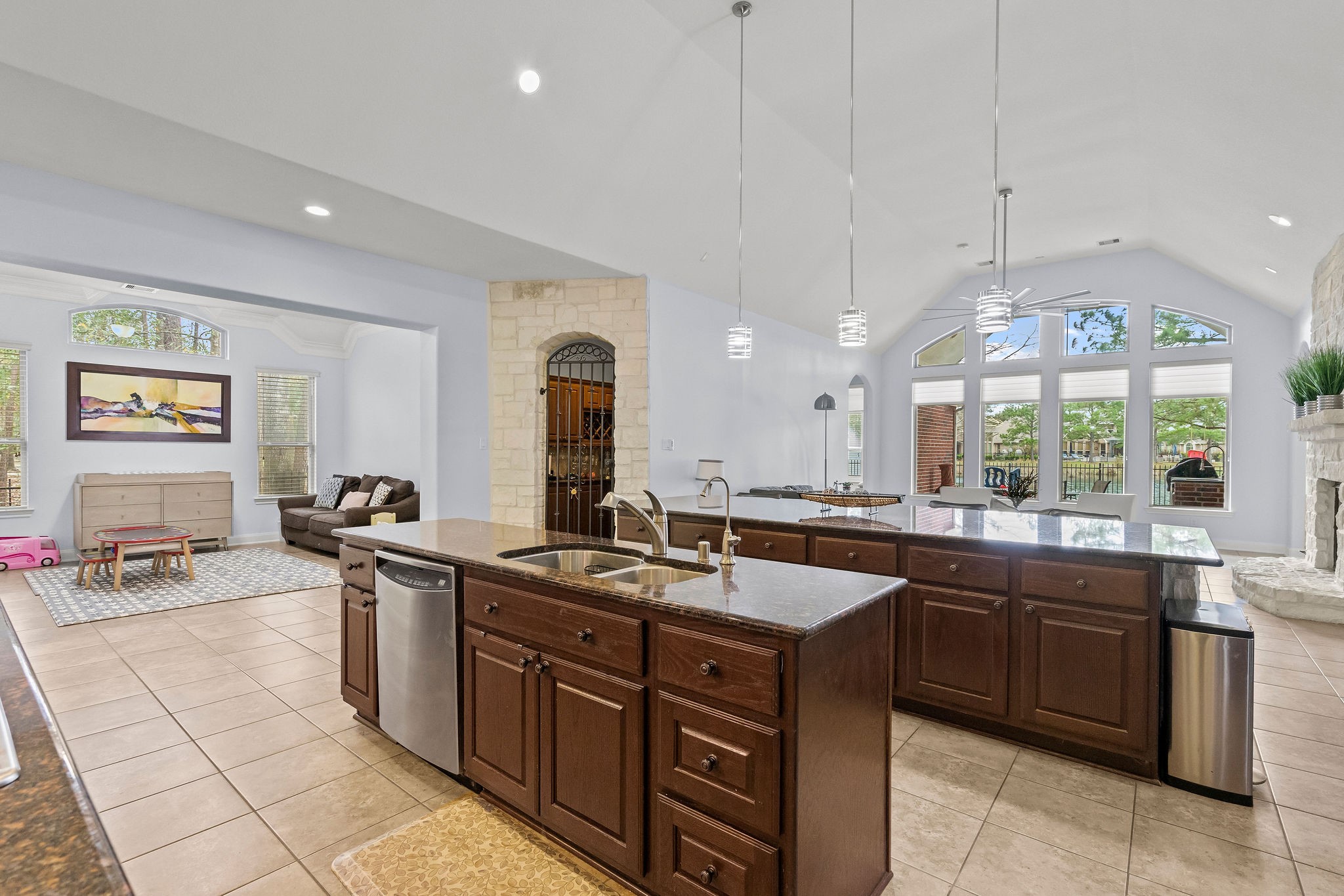 31114 Lakeview Bend Lane Spring, TX 77386 - Photo 18 of 41 a kitchen with stainless steel appliances granite countertop a sink counter space cabinets and a large window