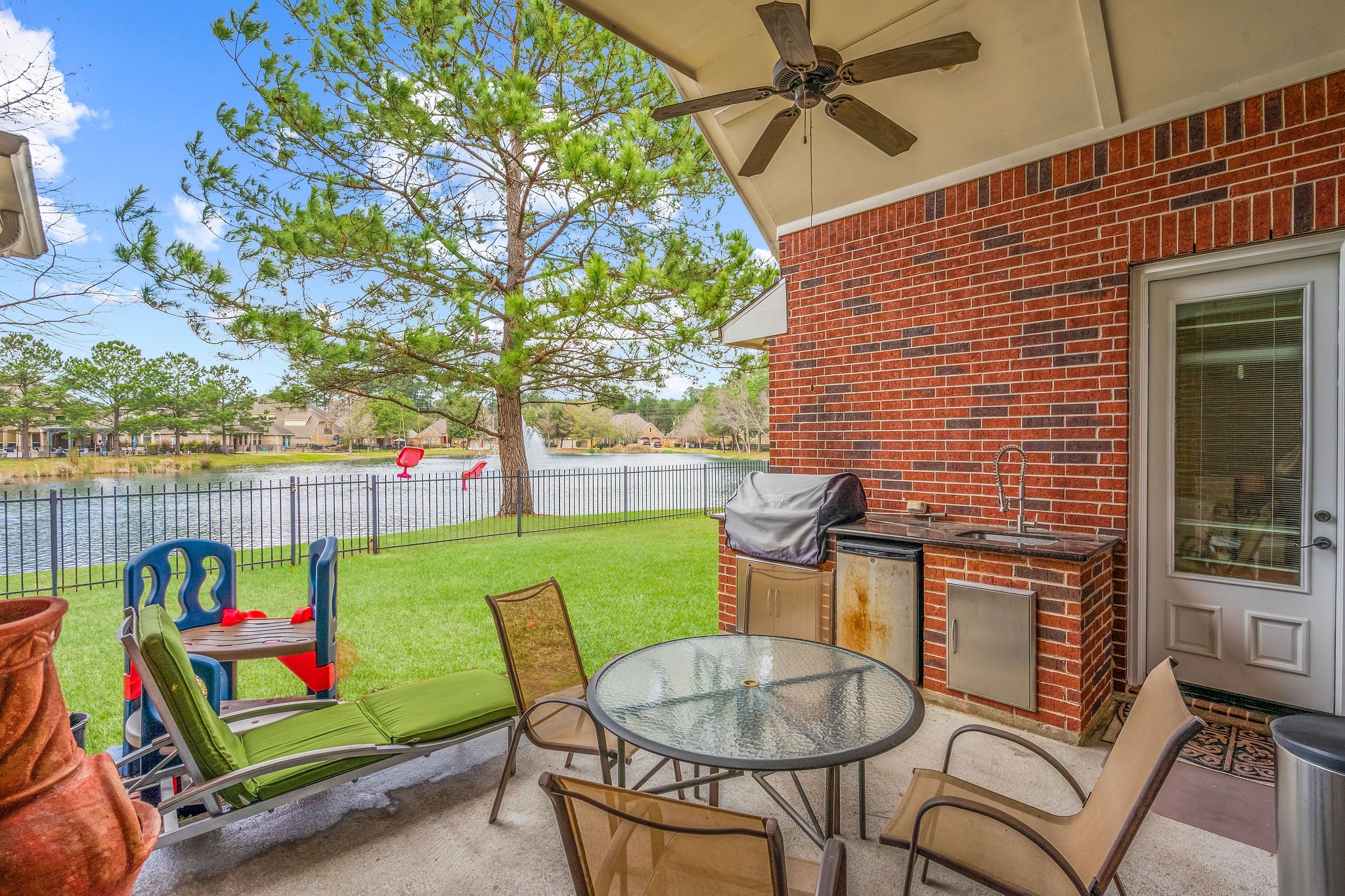 31114 Lakeview Bend Lane Spring, TX 77386 - Photo 2 of 41 a backyard of a house with lots of green space and furniture