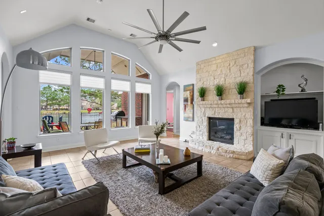 a living room with furniture and a fireplace