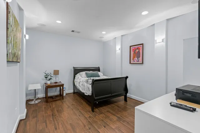 a bedroom with furniture and a window