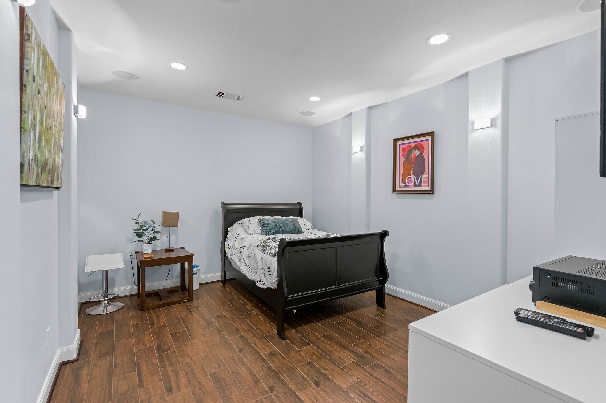 31114 Lakeview Bend Lane Spring, TX 77386 - Photo 25 of 41 a bedroom with furniture and a wooden floor