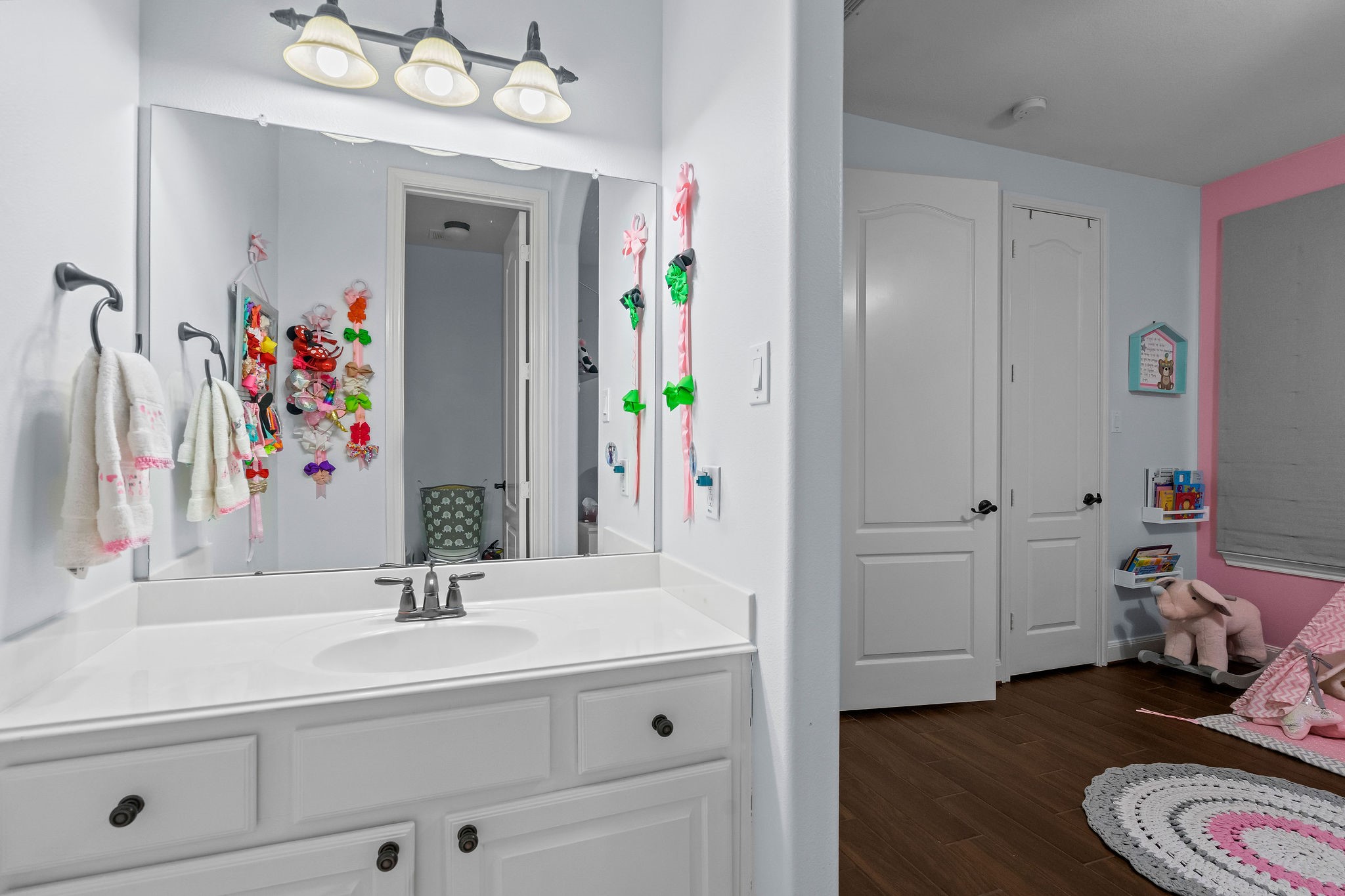 31114 Lakeview Bend Lane Spring, TX 77386 - Photo 29 of 41 a bathroom with a sink a vanity and a mirror