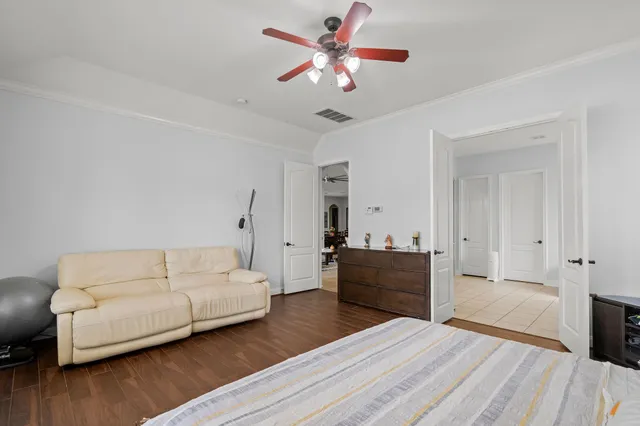 a bathroom with a granite countertop sink a toilet and mirror