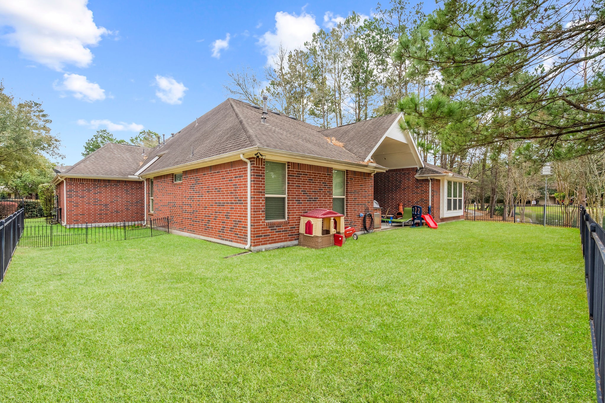 31114 Lakeview Bend Lane Spring, TX 77386 - Photo 9 of 41 a view of a yard with a house and a garden