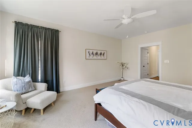 a bedroom with a bed and a couch