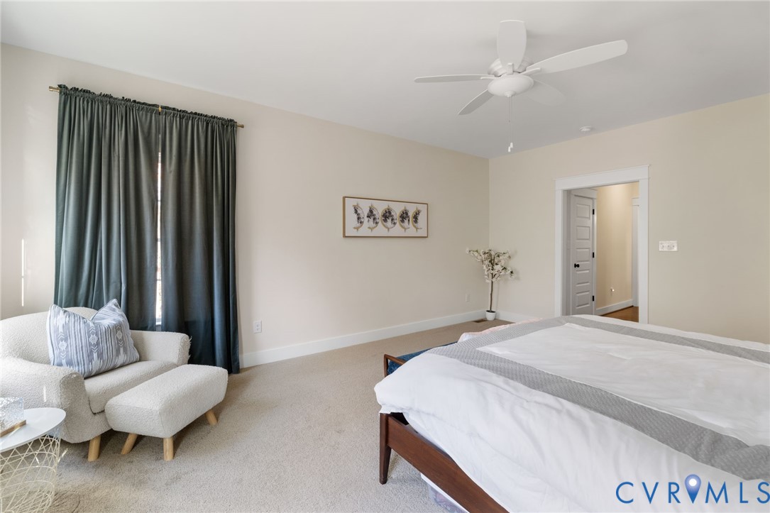 9461 Wickham Crossing Way Ashland, VA 23005 - Photo 11 of 30 a bedroom with a bed and a couch