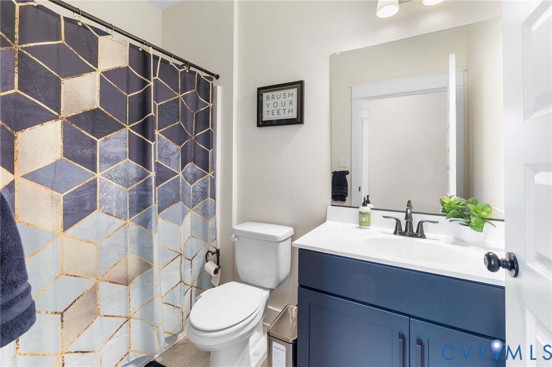 9461 Wickham Crossing Way Ashland, VA 23005 - Photo 19 of 30 a bathroom with a sink toilet and shower
