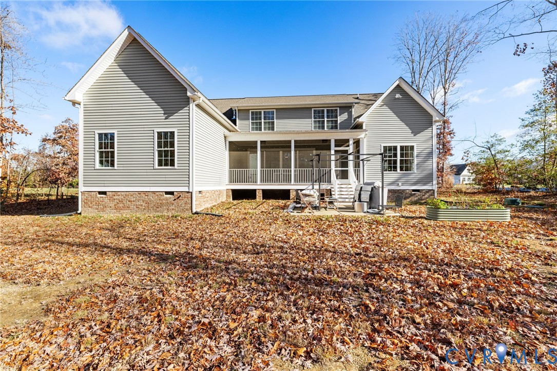 9461 Wickham Crossing Way Ashland, VA 23005 - Photo 27 of 30 a front view of a house with a yard