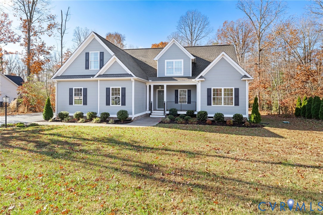9461 Wickham Crossing Way Ashland, VA 23005 - Photo 30 of 30 a front view of a house with a yard