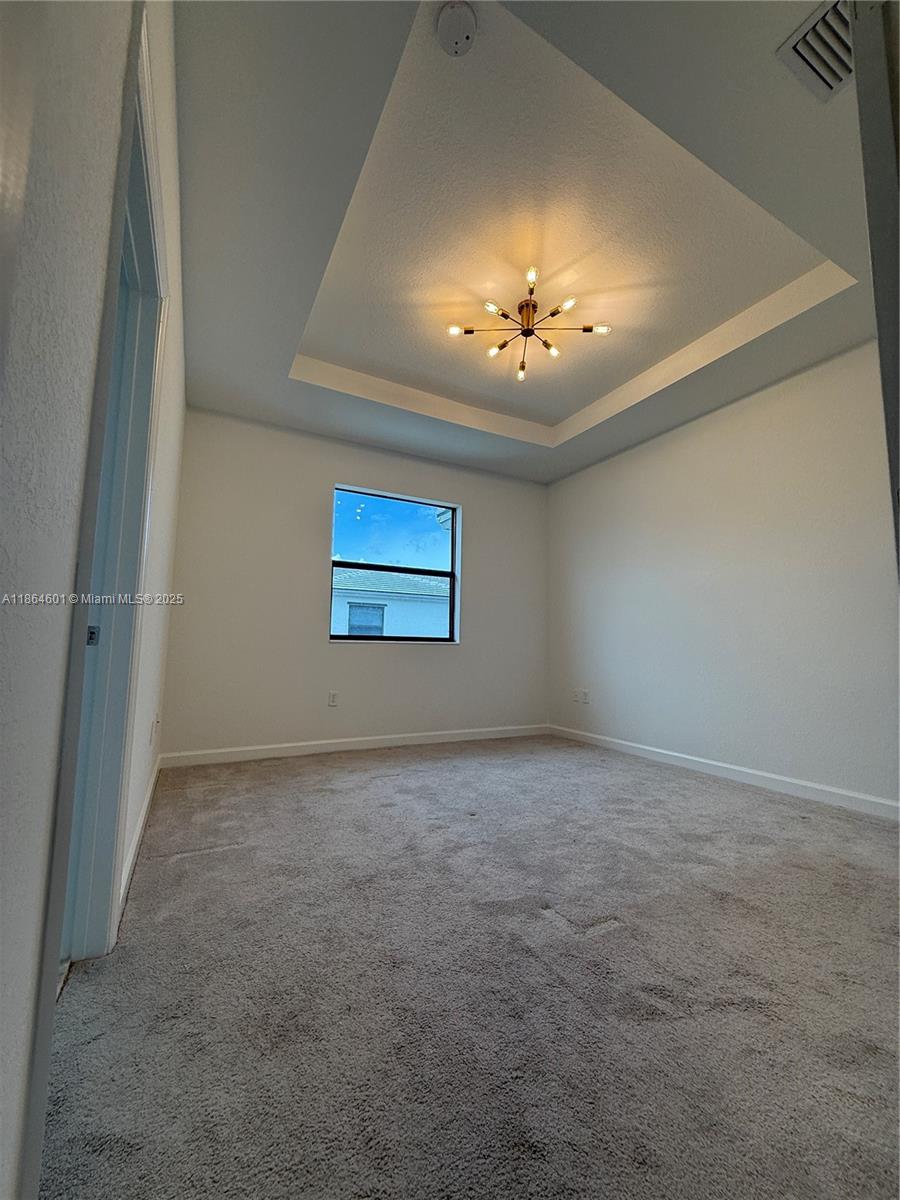 28532 Southwest 133rd Path Homestead, FL 33033 - Photo 11 of 18 a view of an empty room with a window