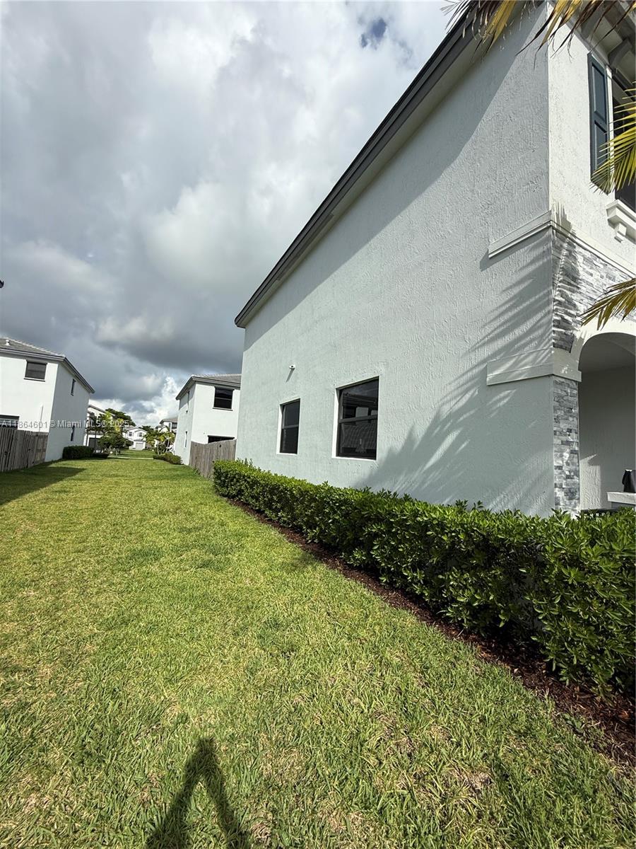 28532 Southwest 133rd Path Homestead, FL 33033 - Photo 6 of 18 a backyard of a house with lots of green space