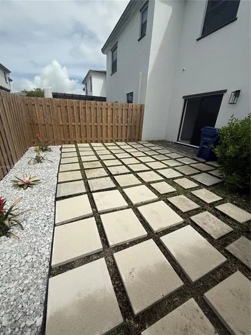 a bedroom with a bed and a night stand