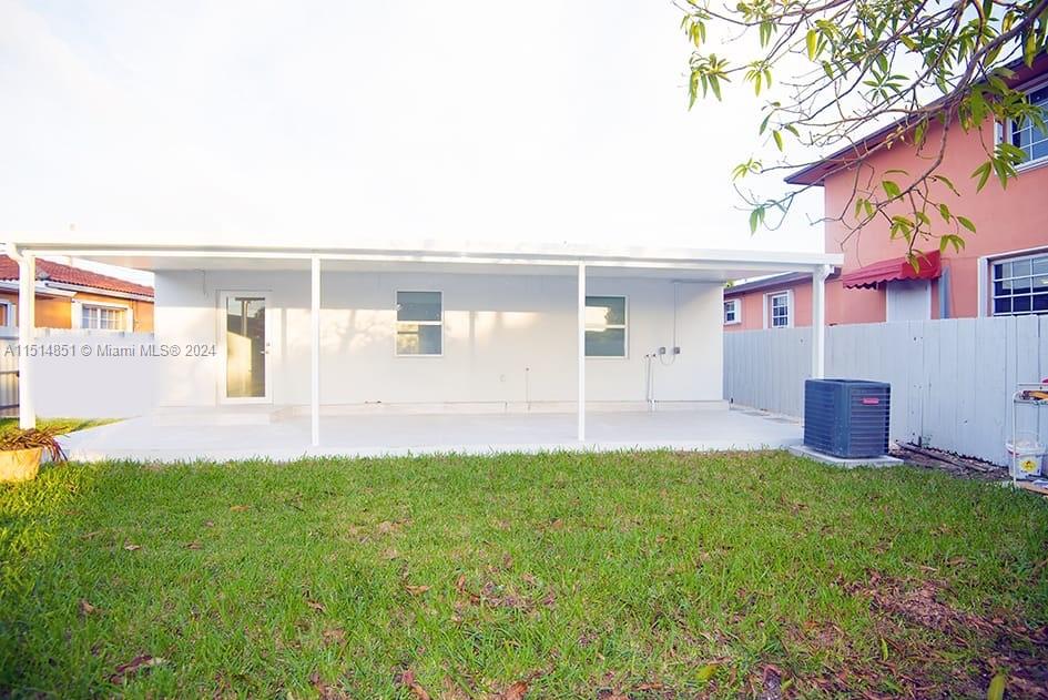 516 Southwest 66th Avenue Miami, FL 33144 - Photo 11 of 27 a view of a house with a yard and a porch