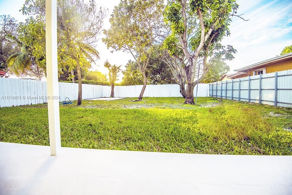 516 Southwest 66th Avenue Miami, FL 33144 - Photo 12 of 27 a view of a swimming pool with a yard