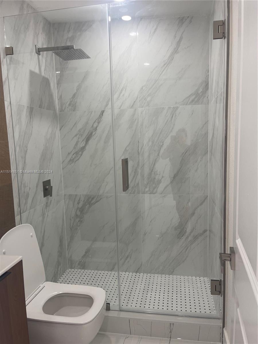 516 Southwest 66th Avenue Miami, FL 33144 - Photo 15 of 27 a bathroom with a toilet and shower