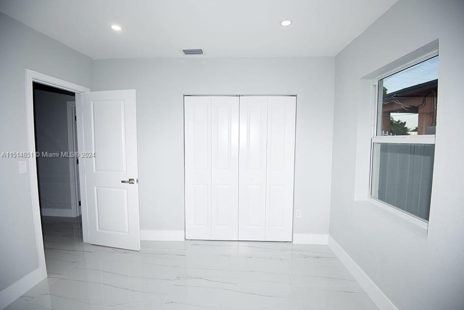 516 Southwest 66th Avenue Miami, FL 33144 - Photo 18 of 27 a view of an empty room and closet area
