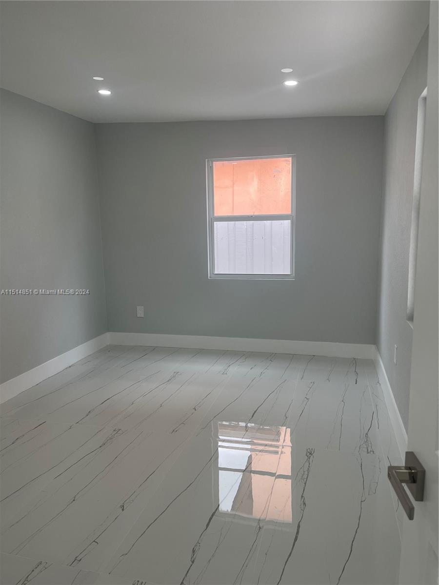 516 Southwest 66th Avenue Miami, FL 33144 - Photo 19 of 27 an empty room with windows